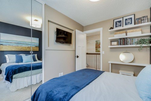 1220 Meadowbrook Drive Se, Airdrie, AB - Indoor Photo Showing Bedroom