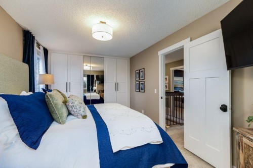 1220 Meadowbrook Drive Se, Airdrie, AB - Indoor Photo Showing Bedroom