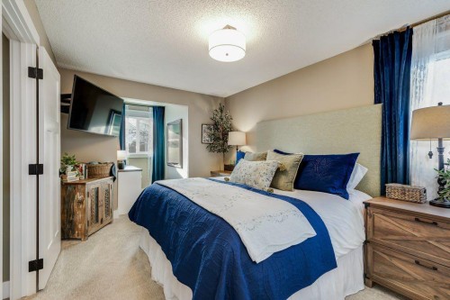 1220 Meadowbrook Drive Se, Airdrie, AB - Indoor Photo Showing Bedroom