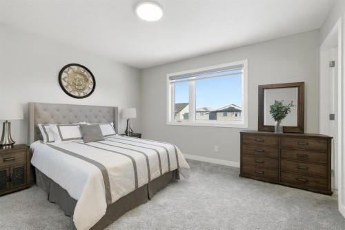 936 Reynolds Lane Sw, Airdrie, AB - Indoor Photo Showing Bedroom