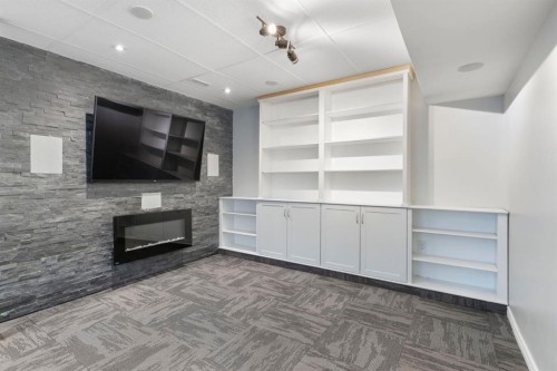 99 Sage Valley Park Nw, Calgary, AB - Indoor Photo Showing Other Room With Fireplace