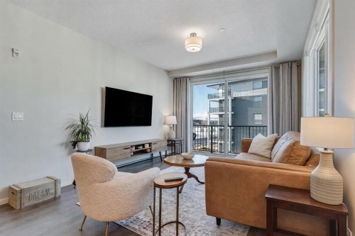 1311-740 Legacy Village Road Se, Calgary, AB - Indoor Photo Showing Living Room