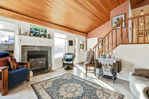 808 5 Avenue Sw, High River, AB - Indoor Photo Showing Living Room With Fireplace