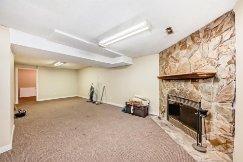 247 Bracewood Road Sw, Calgary, AB - Indoor With Fireplace