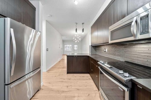 708 Evansridge Common Nw, Calgary, AB - Indoor Photo Showing Kitchen With Upgraded Kitchen