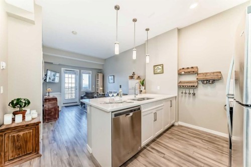 413-20 Mahogany Mews Se, Calgary, AB - Indoor Photo Showing Kitchen With Double Sink With Upgraded Kitchen