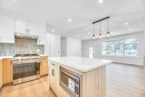 32 Allandale Close Se, Calgary, AB - Indoor Photo Showing Kitchen With Upgraded Kitchen