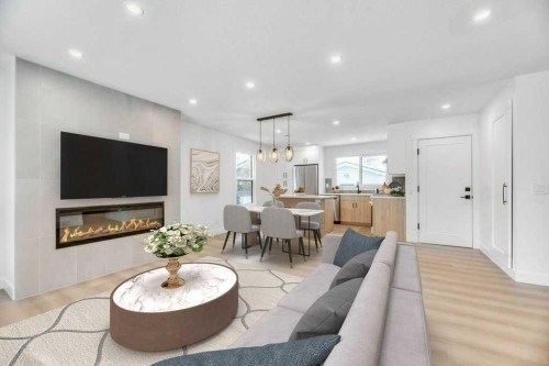 32 Allandale Close Se, Calgary, AB - Indoor Photo Showing Living Room With Fireplace