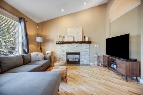 113 Somerside Green Sw, Calgary, AB - Indoor Photo Showing Living Room With Fireplace