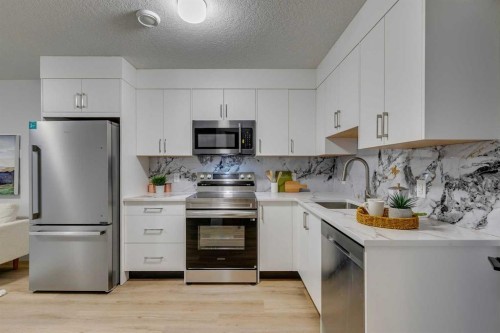 2013 23 Avenue Nw, Calgary, AB - Indoor Photo Showing Kitchen With Stainless Steel Kitchen