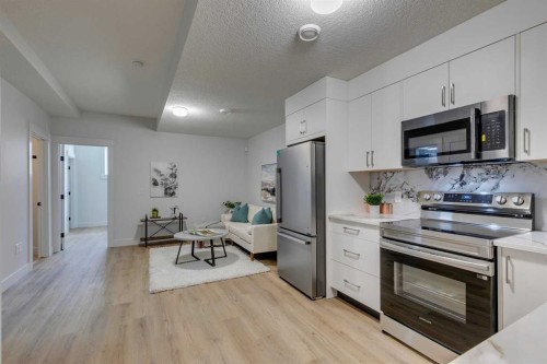 2013 23 Avenue Nw, Calgary, AB - Indoor Photo Showing Kitchen With Stainless Steel Kitchen