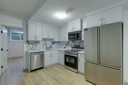 2015 23 Avenue Nw, Calgary, AB - Indoor Photo Showing Kitchen With Stainless Steel Kitchen
