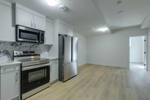 2015 23 Avenue Nw, Calgary, AB - Indoor Photo Showing Kitchen With Stainless Steel Kitchen