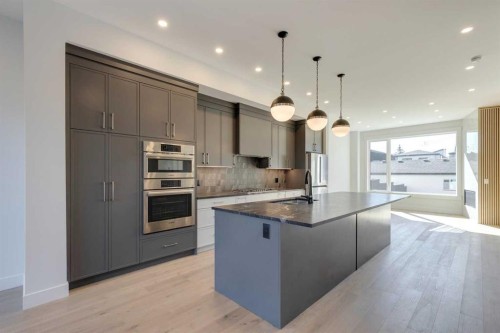 2015 23 Avenue Nw, Calgary, AB - Indoor Photo Showing Kitchen With Stainless Steel Kitchen With Upgraded Kitchen