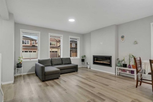 124 Cityside Crescent Ne, Calgary, AB - Indoor Photo Showing Living Room With Fireplace