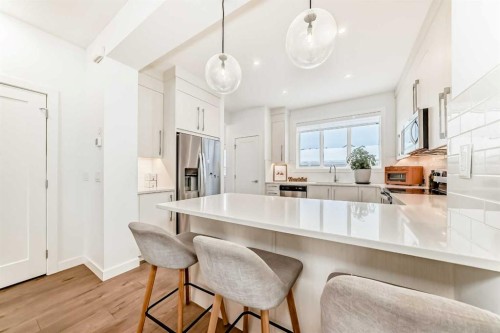 106 Dawson Harbour Grove, Chestermere, AB - Indoor Photo Showing Kitchen With Upgraded Kitchen