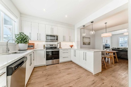 106 Dawson Harbour Grove, Chestermere, AB - Indoor Photo Showing Kitchen With Upgraded Kitchen