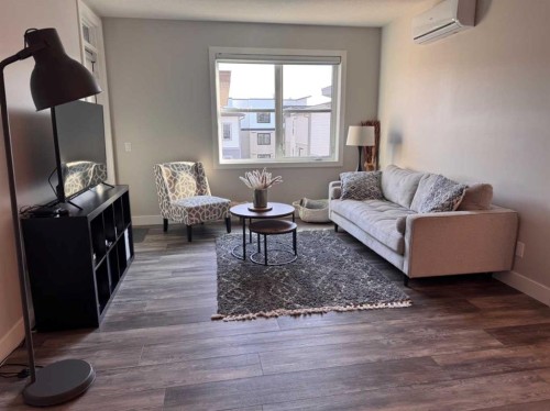 110-8355 19 Avenue Sw, Calgary, AB - Indoor Photo Showing Living Room