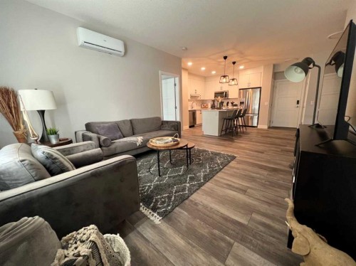 110-8355 19 Avenue Sw, Calgary, AB - Indoor Photo Showing Living Room