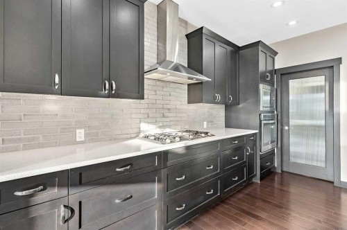 90 Mount Rae Heights, Okotoks, AB - Indoor Photo Showing Kitchen With Upgraded Kitchen