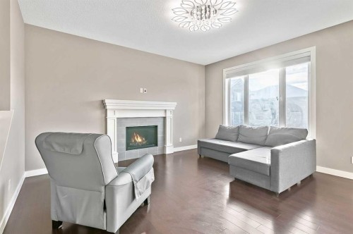90 Mount Rae Heights, Okotoks, AB - Indoor Photo Showing Living Room With Fireplace