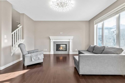 90 Mount Rae Heights, Okotoks, AB - Indoor Photo Showing Living Room With Fireplace