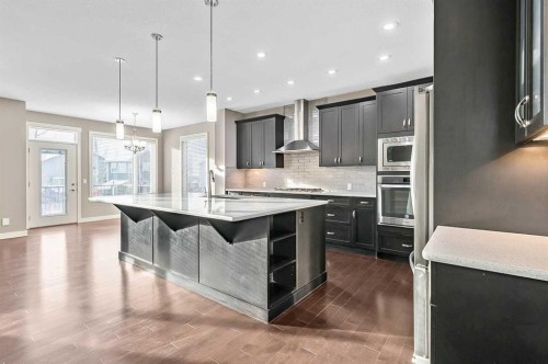 90 Mount Rae Heights, Okotoks, AB - Indoor Photo Showing Kitchen With Upgraded Kitchen