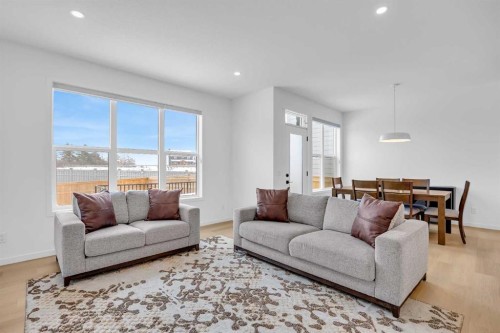16 Magnolia Bay Se, Calgary, AB - Indoor Photo Showing Living Room