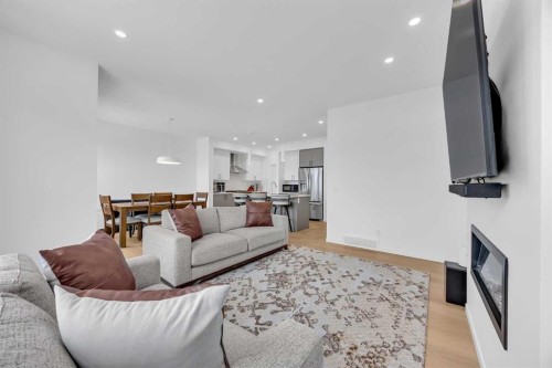 16 Magnolia Bay Se, Calgary, AB - Indoor Photo Showing Living Room