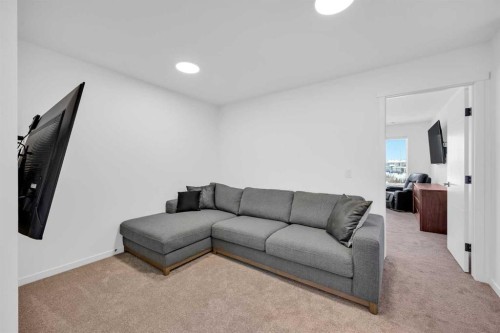 16 Magnolia Bay Se, Calgary, AB - Indoor Photo Showing Living Room