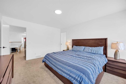 16 Magnolia Bay Se, Calgary, AB - Indoor Photo Showing Bedroom