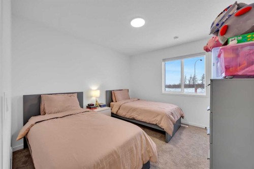 16 Magnolia Bay Se, Calgary, AB - Indoor Photo Showing Bedroom