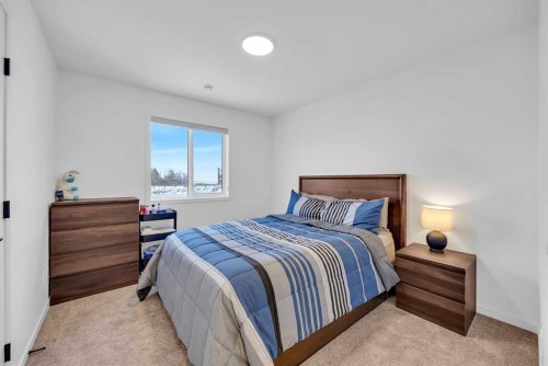 16 Magnolia Bay Se, Calgary, AB - Indoor Photo Showing Bedroom