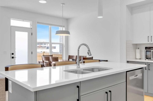 16 Magnolia Bay Se, Calgary, AB - Indoor Photo Showing Kitchen With Double Sink With Upgraded Kitchen