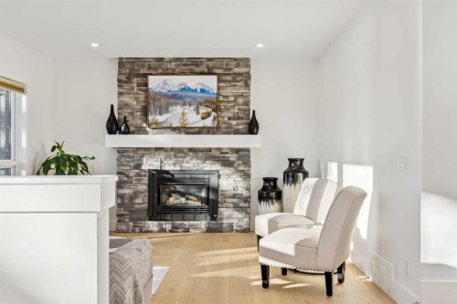 5 Mckenzie Lake Point Se, Calgary, AB - Indoor Photo Showing Living Room With Fireplace