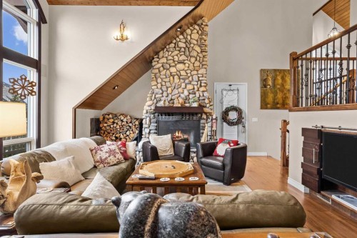 12 Antelope Lane, Banff, AB - Indoor Photo Showing Other Room With Fireplace