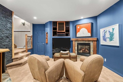 12 Antelope Lane, Banff, AB - Indoor Photo Showing Living Room With Fireplace