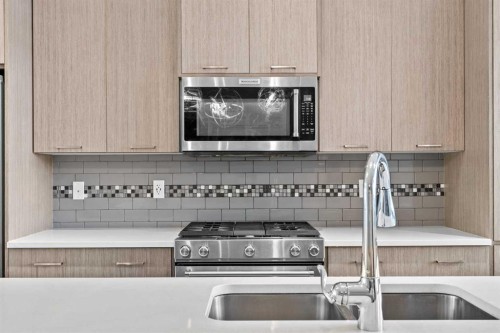 18 Evanscrest Heights Nw, Calgary, AB - Indoor Photo Showing Kitchen With Double Sink