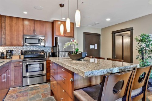 319D-1818 Mountain Avenue, Canmore, AB - Indoor Photo Showing Kitchen With Upgraded Kitchen