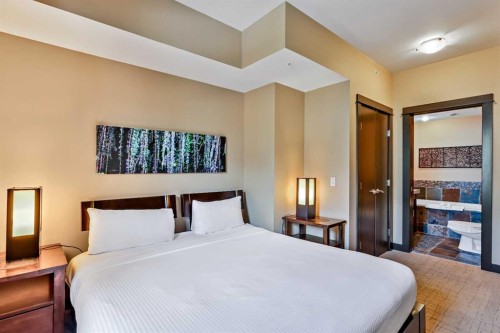 319D-1818 Mountain Avenue, Canmore, AB - Indoor Photo Showing Bedroom