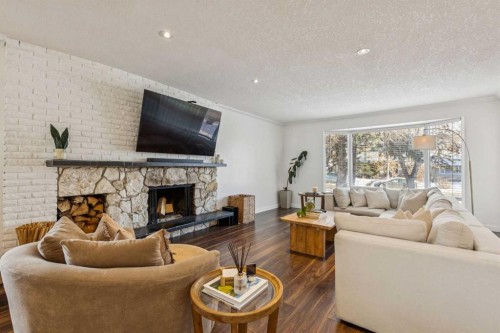 3731 45 Street Sw, Calgary, AB - Indoor Photo Showing Living Room With Fireplace