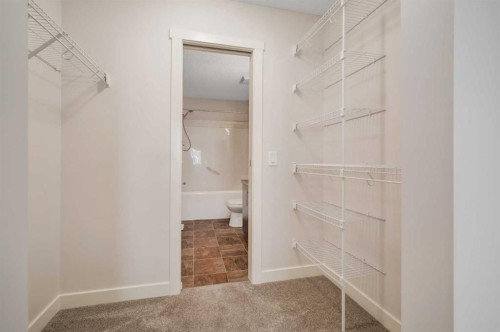 1203-2445 Kingsland Road Se, Airdrie, AB - Indoor With Storage