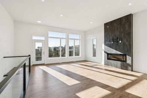 228 Sovereign Common Sw, Calgary, AB - Indoor Photo Showing Living Room With Fireplace