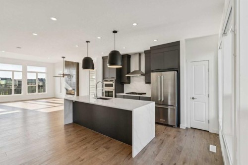 228 Sovereign Common Sw, Calgary, AB - Indoor Photo Showing Kitchen With Stainless Steel Kitchen With Upgraded Kitchen