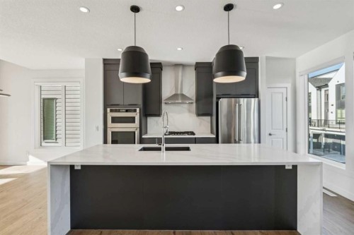 228 Sovereign Common Sw, Calgary, AB - Indoor Photo Showing Kitchen With Stainless Steel Kitchen With Upgraded Kitchen