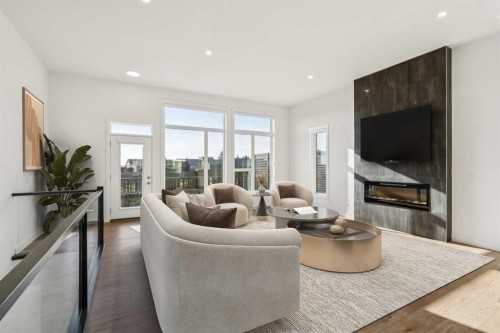 228 Sovereign Common Sw, Calgary, AB - Indoor Photo Showing Living Room With Fireplace