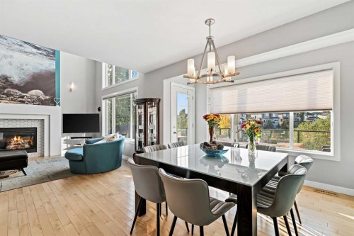 92 Cranwell Green Se, Calgary, AB - Indoor Photo Showing Dining Room With Fireplace