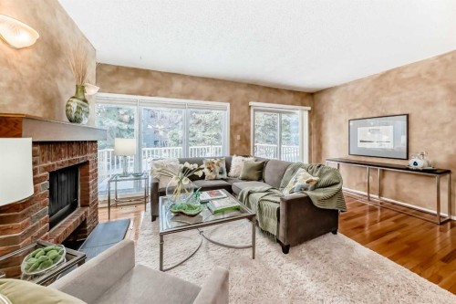 219 Point Mckay Terrace Nw, Calgary, AB - Indoor Photo Showing Living Room With Fireplace