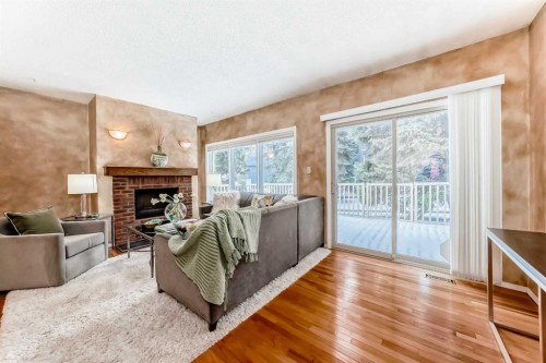 219 Point Mckay Terrace Nw, Calgary, AB - Indoor Photo Showing Living Room With Fireplace