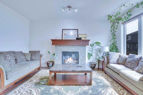 21 Saddlelake Gardens Ne, Calgary, AB - Indoor Photo Showing Living Room With Fireplace